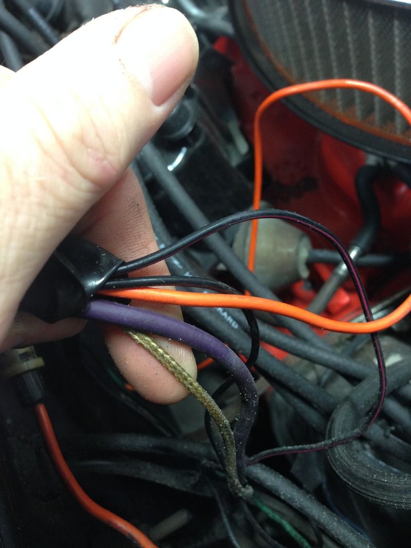 The thin black wire with the red stripe goes to the TCS relay on the cowl,  the solid black wire goes to the TCS switch that is manifold mounted. The  orange ...