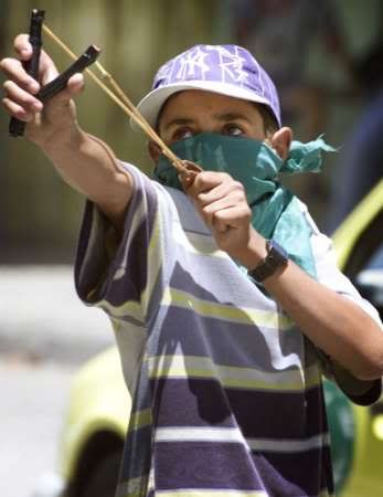 Palestinian Defending His Home